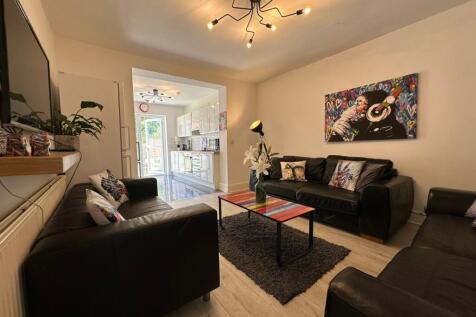 This stylish living room features contemporary ...