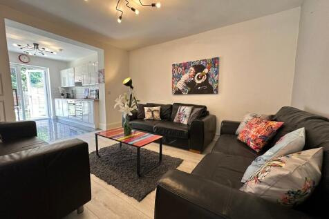 A stylish living room featuring modern furnitur...