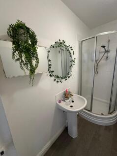 A bright and modern bathroom featuring a stylis...