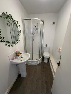 A modern bathroom featuring a stylish shower cu...