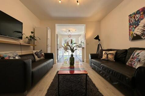 A stylish and welcoming living room featuring c...