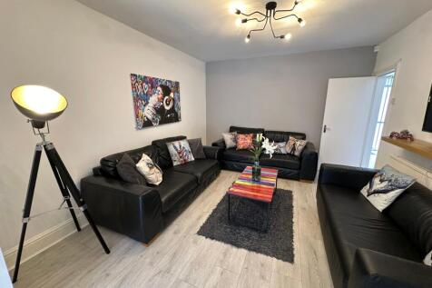 A stylish and inviting living room featuring co...