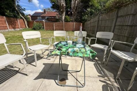 A beautifully maintained garden space featuring...