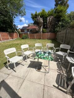 A spacious garden area featuring a well-maintai...