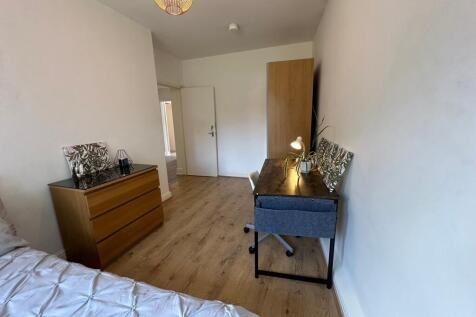 This charming double bedroom features a cozy la...