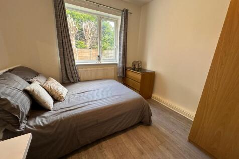 A cozy double bedroom featuring stylish decor, ...
