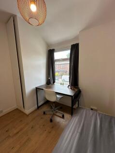 Bright and inviting double bedroom featuring a ...