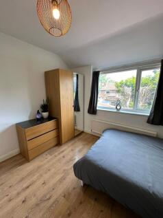 This charming double bedroom offers a cozy retr...