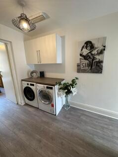 A stylish and modern kitchen area featuring int...