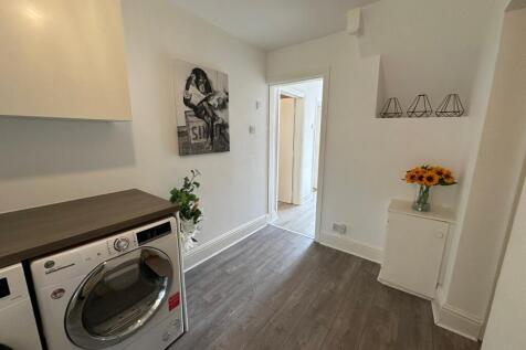Bright and modern kitchen area featuring stylis...