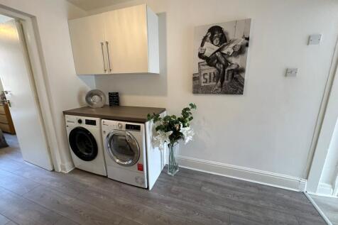 This well-appointed kitchen features modern app...