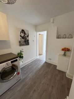 Bright and inviting kitchen area featuring mode...