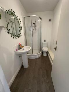 A bright and modern bathroom featuring a sleek ...