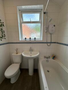 This well-maintained bathroom features a bathtu...