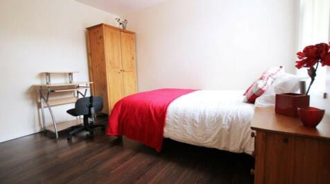 A bright and inviting double bedroom featuring ...
