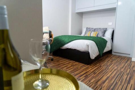 A stylish and inviting double bedroom featuring...