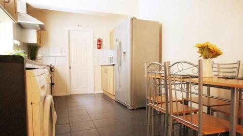 A bright and tidy kitchenette featuring modern ...