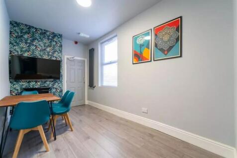 This inviting communal lounge features modern d...