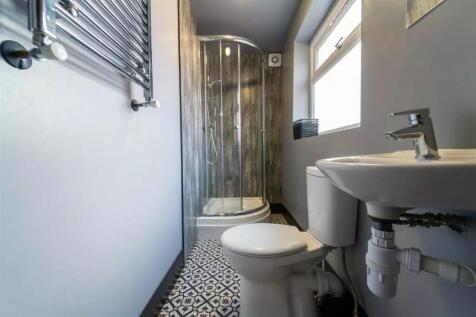 This modern bathroom features a sleek design wi...