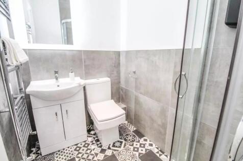 This modern bathroom features stylish tile work...