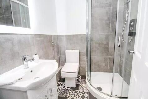 This modern bathroom features a sleek design wi...
