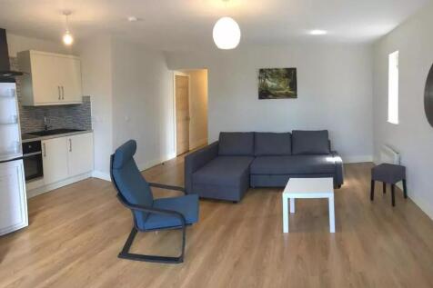Spacious and inviting living room featuring mod...
