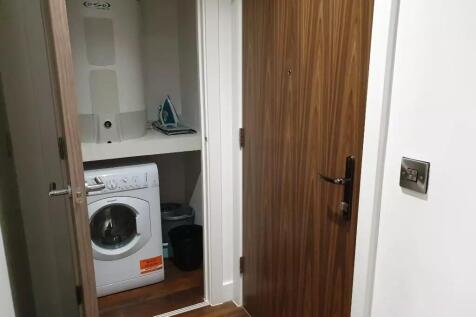 This compact storage area features essential am...