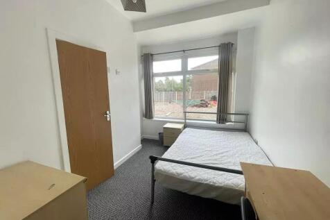 This charming double bedroom features large win...