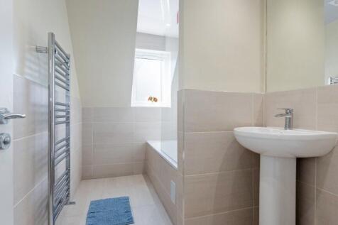 A beautifully maintained bathroom featuring a c...