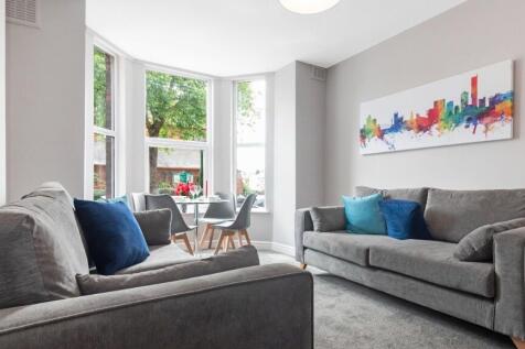 A bright and inviting living room featuring mod...