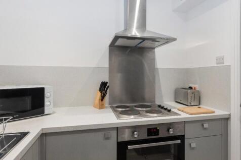 Modern kitchen featuring sleek appliances and a...