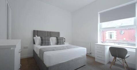 Bright and inviting double bedroom featuring a ...