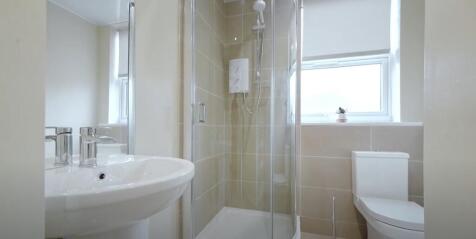 A well-maintained bathroom featuring a modern s...