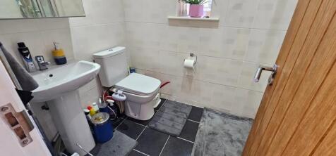 A well-maintained bathroom featuring modern fix...