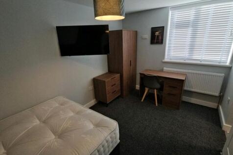 A bright and inviting double bedroom featuring ...