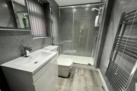Stylish and modern bathroom suite featuring a s...