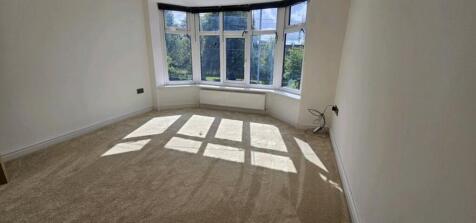 Bright and spacious double bedroom featuring la...