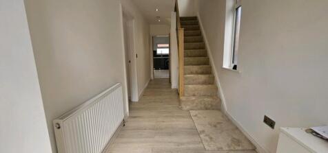 A well-maintained hallway featuring modern deco...