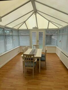Bright and airy communal lounge with a vaulted ...
