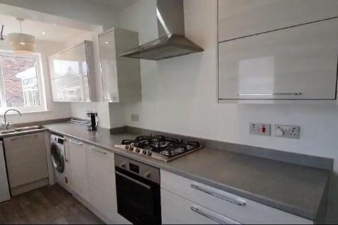 Bright and modern kitchen with ample countertop...