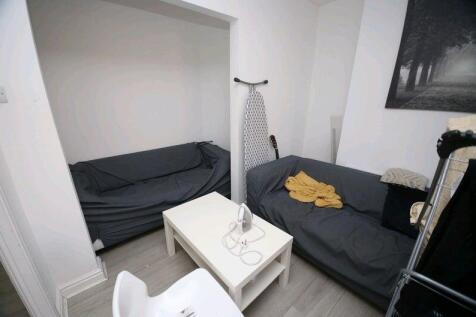Cozy communal lounge featuring two comfortable ...