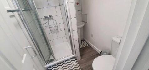 Bright and clean bathroom featuring a modern wa...