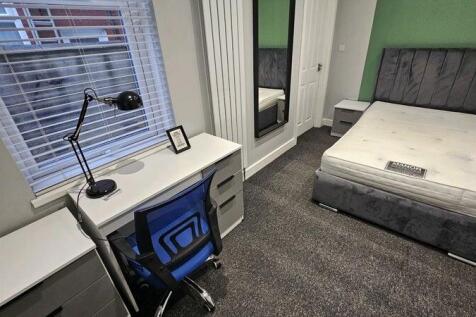 A modern double bedroom featuring a comfortable...