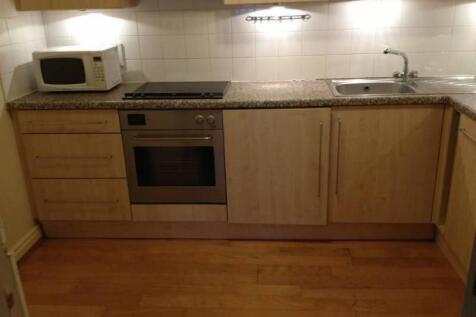 A neat and functional kitchen featuring modern ...
