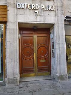 Elegant entrance of Oxford Place 7 featuring cl...