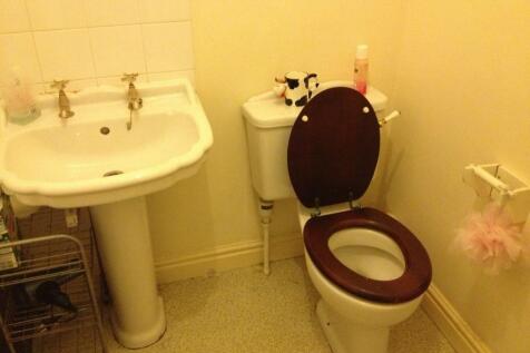 A compact and functional bathroom featuring a c...