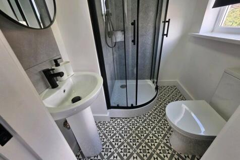 A modern bathroom featuring a clean and stylish...