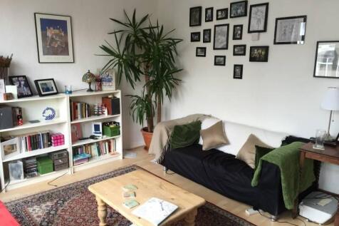 A cozy living room featuring a comfortable sofa...