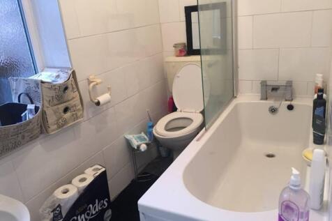 A bright and clean bathroom featuring a spaciou...