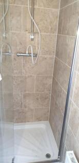 A clean and modern shower enclosure featuring n...